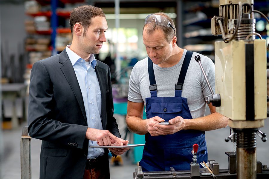 A manufacturing manager micromanaging an employee