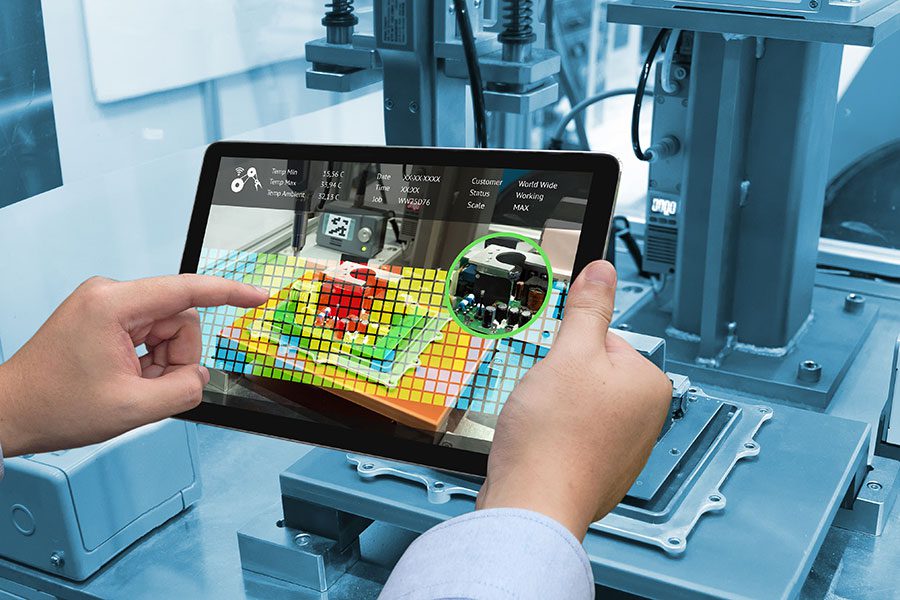 A worker utilising industry 4.0 to make manufacturing improvements