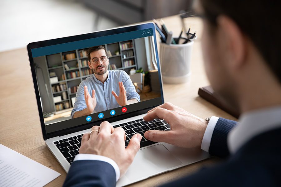 A banking employee communicating with a client over a video call